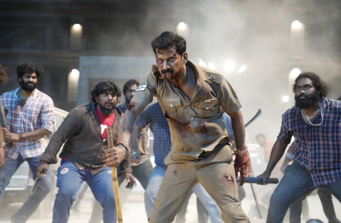 still from movie Laththi