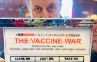 Anupam Kher with clapboard of The Vaccine War